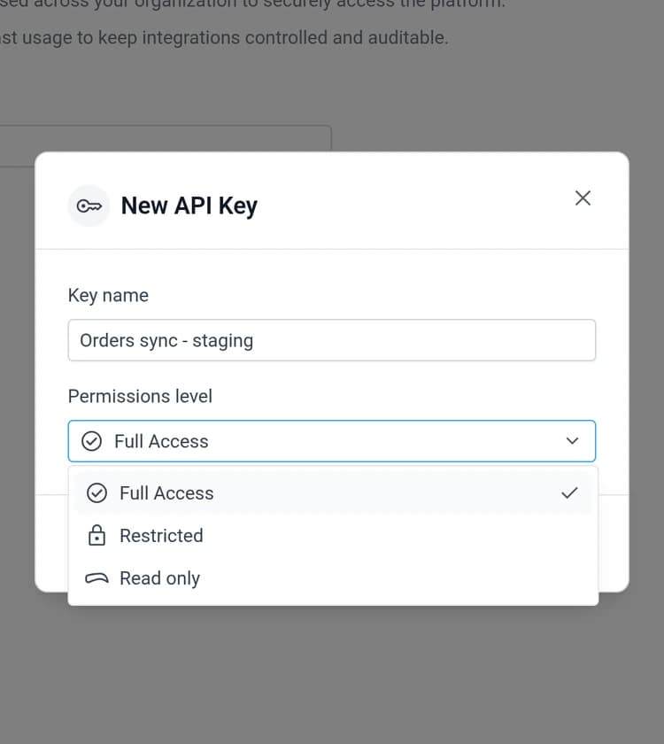 The New API Key dialog with the permission level dropdown open showing Full Access, Restricted and Read only